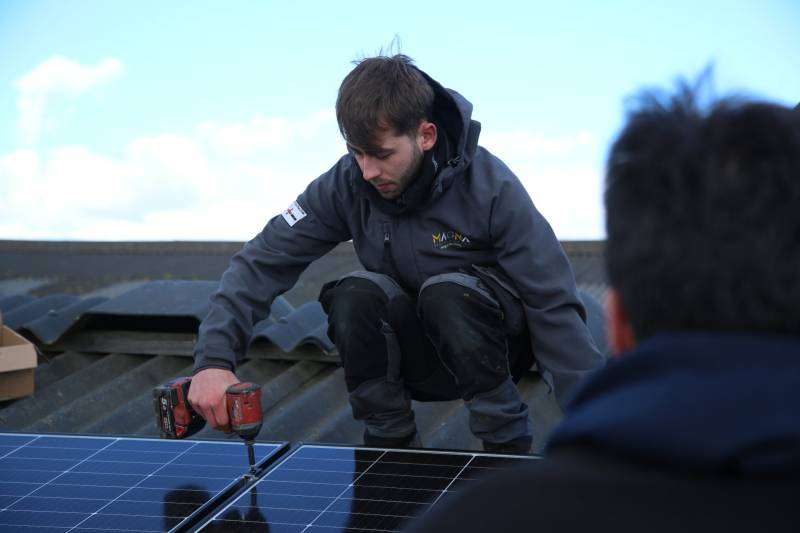 Luke Dulson Installing solar panels